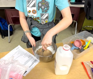 Mixing doughnut glaze