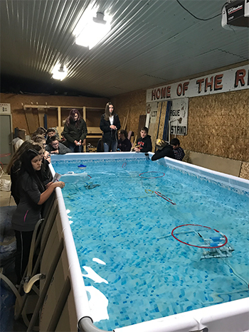 Students at Clinton High School practice with underwater robots
