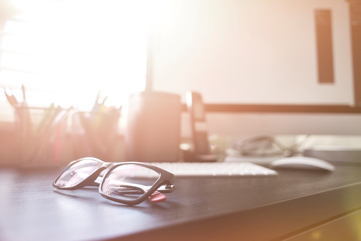 Glasses on home office desk