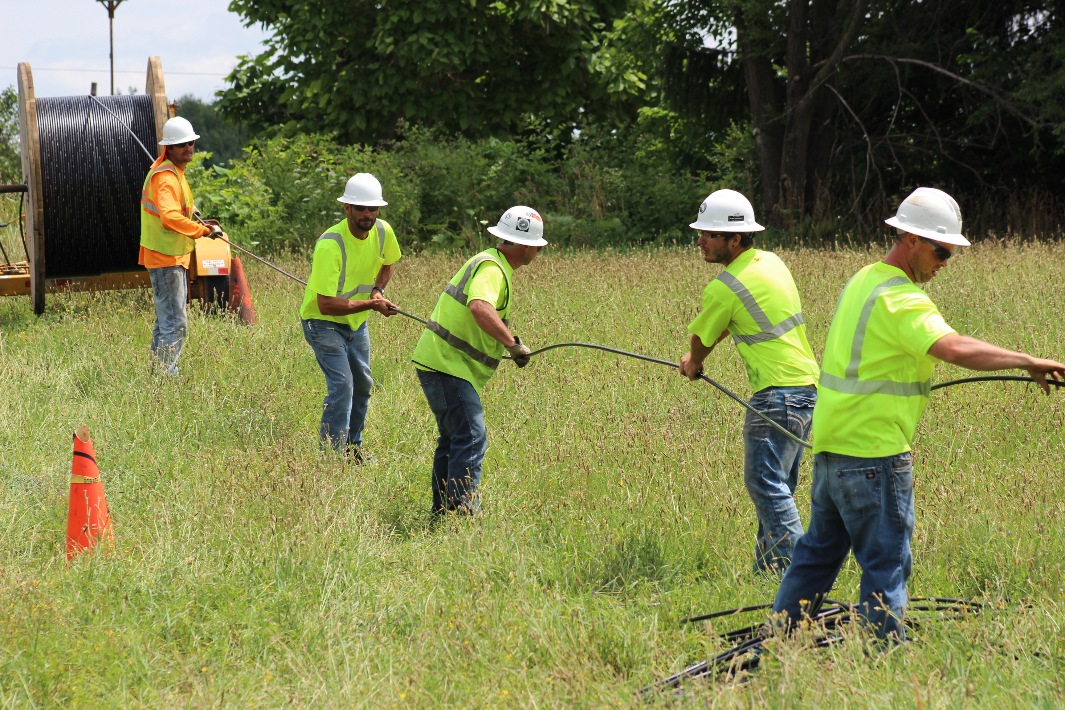Crews pulling fiber