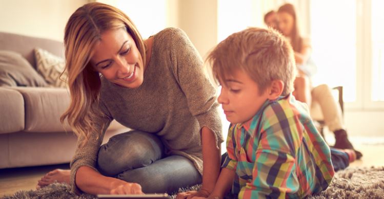 Mom and Child looking at an iPad