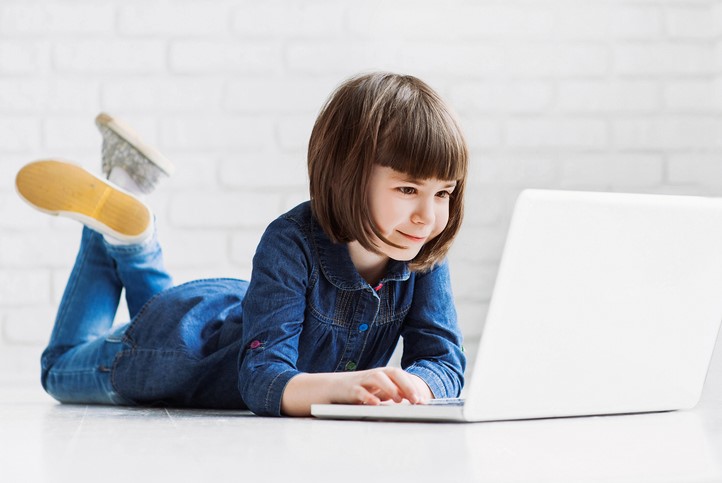 Girl using computer online resources for studying